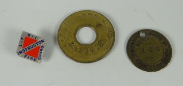 A Glamorgan Coal Company Ltd Llwynypia safety lamp token together with another & a fire guard