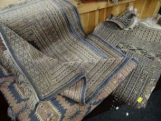 Four various patterned woollen Persian-style rugs