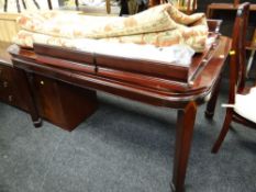 An Oriental cherry wood or similar extending dining table together with 6+2 matching armchairs