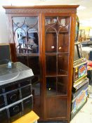 A good antique mahogany standing corner cabinet
