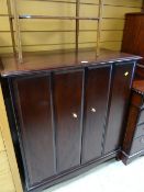 A Stag Minstrel entertainment cabinet with concertina doors