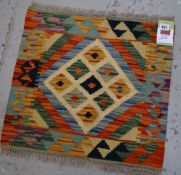 A vegetable dyed wool Choli Kilim mat, 43 x 50cms
