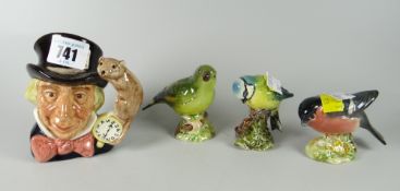 Three Beswick birds, blue tit etc together with a small Doulton character jug 'Mad Hatter'