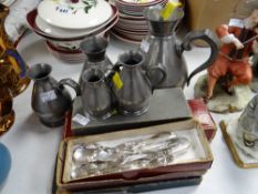 Five graduated pewter measures, boxed flatware