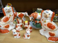 Three pairs of graduated size Staffordshire dogs together with three Staffordshire flat backs (