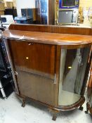 A good quality vintage mahogany china cabinet with abbatant cupboard on ball & claw feet