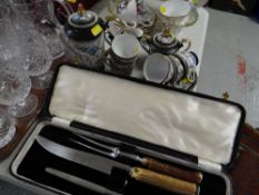 A bone-handled three-piece carving set & an Oriental cabinet coffee set