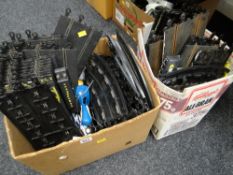 A box of various Scale electric track & equipment