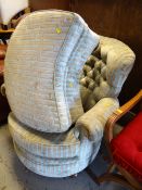 A modern arabesque upholstered tub-type chair & kidney shaped foot stool