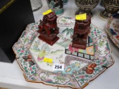 An hexagonal famille verte decorative plate & a pair of composition dog of foo ornaments