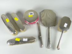 A hallmarked silver dressing table set