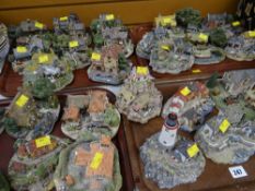 A quantity of Danbury Mint pottery cottages