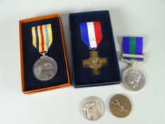 A UN Suez Canal Zone medal, French General Service medal replica, Elizabeth II General Service