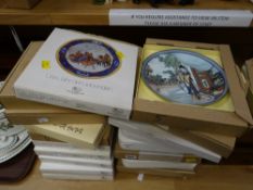 A collection of boxed collectors plates