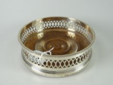 A hallmarked silver London 1969 bottle coaster