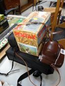 A boxed Pentax camera, two older cameras etc