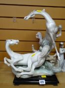 Large Lladro figurine of a rearing horse & another on wooden plinth