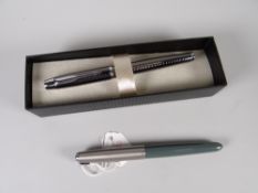 A MODERN BOXED GUNMETAL PARKER FOUNTAIN PEN with cube design together with a vintage grey Parker