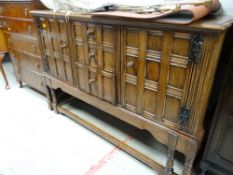 A Jacobean-style oak sideboard