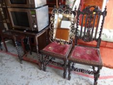 A pair of antique carved chairs, an occasional table & a mirror