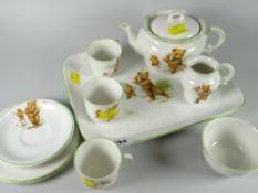 A lovely nursery teaset circa 1905 with teddy bears playing cricket, football, golf & skating
