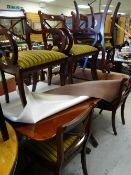 A reproduction twin-pedestal mahogany extending dining table & 4+2 chairs