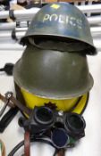 Three protective work helmets, one printed 'Police' & another with a fire brigade crest, two pairs