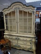 A French-style painted glazed dresser with bombe shape base