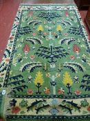 Green patterned rug, approximately 64 x 46 ins