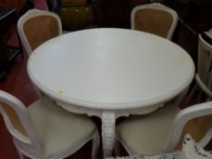 White circular dining table and four vendor gifted cane backed chairs