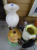 Falcon ware Art Deco vase and one other, a cottage ware teapot on stand, an EPBM teapot presented by