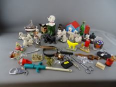 Quantity of collectable dog figurines, drinks bottle stoppers etc