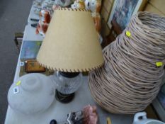 Decorative table lamp, a bottle shaped wicker basket, a floral decorated lampshade