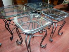 Parcel of four (two large, two small) ornate metal framed occasional tables with glass tops