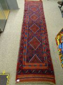 Meshwani carpet runner, red and blue ground with repeating diamond central pattern and bordered