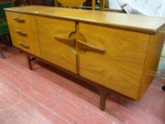 Mid Century sideboard with three drawers and twin cupboards with interesting handles