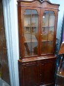 Excellent modern corner cupboard of two upper glazed doors over two base cupboards