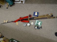 Two modern fly fishing rods by Hardys and Shakespeare, an Abu Garcia spinning rod and a keep net,