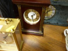 Three mantel clocks