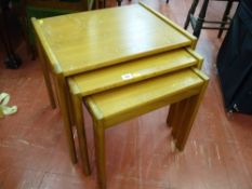 Nest of three teak coffee tables