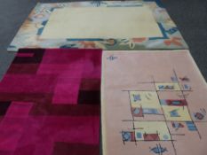 Parcel of three geometric patterned rugs