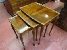 Piecrust edge nest of three coffee tables