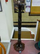 Victorian carved mahogany torchere on a circular base