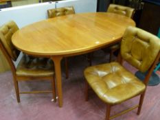 Mid Century oval extending dining table and four vendor gifted chairs