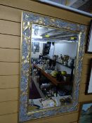 Modern swept gilt framed wall mirror