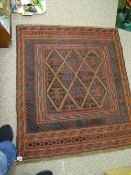 Cazak rug, tonal red, blue and brown, multiple bordered with classical central block pattern, 118