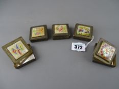 Five white metal lidded boxes with painted mother of pearl top panels