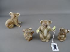 Group of four Beswick koala figurines