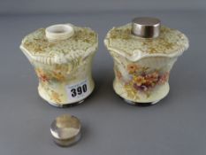 Pair of Doulton Burslem pottery canisters with silver lids and floral decoration