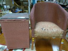 Lloyd loom style armchair and a glass lidded linen basket